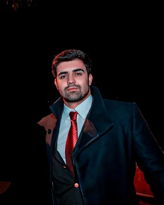 Berto Barata in a suit and overcoat, a night portrait in Lisbon